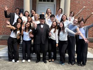 Dennis Clements poses with students on the last day of class.
